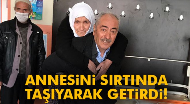 Annesini sırtında taşıyarak oy kullanmaya getirdi